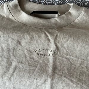 Never worn before tags still on ESSENTIALS shirt
